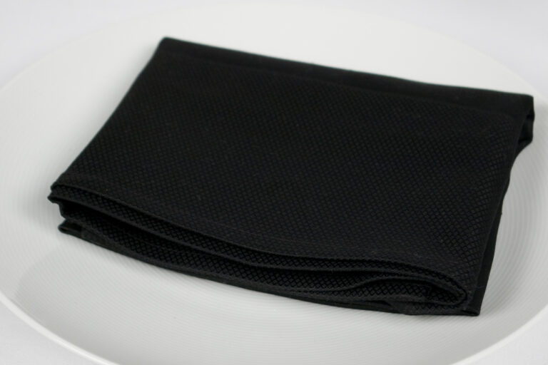 Napkin over a white plate